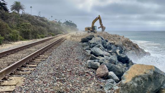 Piling riprap along the tracks south of San Clemente State Beach is an ongoing effort to keep the waves at bay since the beach here has eroded almost entirely in recent years. (Jill Replogle / LAist)